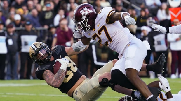 Nov 11, 2023; West Lafayette, Indiana, USA; Purdue Boilermakers tight end Garrett Miller (88) runs a catch in for a touchdown against Minnesota Golden Gophers defensive back Tyler Nubin (27) during the first half at Ross-Ade Stadium.